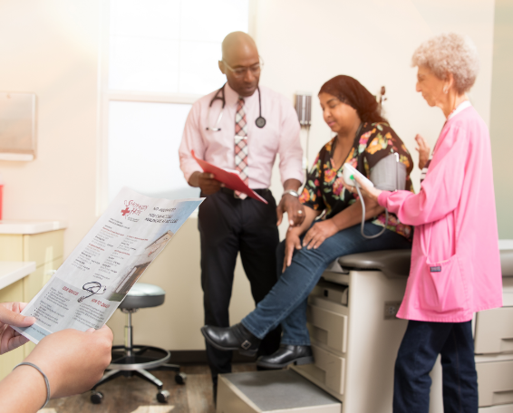 Clinician checking a patient's blood pressure